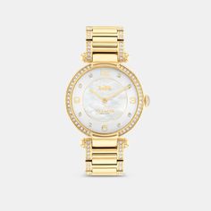 Timeless and elegant the Cary watch is a sophisticated style perfect for day or night. The gold tone bracelet design shimmers with crystals and features a luminous mother-of-pearl dial with our iconic Horse and Carriage motif for a heritage touch. | Coach Cary Watch, 34 Mm - Women's - Gold Elegant Gold-tone Watch With Round Dial, Classic Gold Coach Watch, Elegant Coach Jewelry With Polished Finish, Gold Coach Watch With Metal Dial, Coach Gold Watch With Metal Dial, Coach Gold Watches With Metal Dial, Classic Gold-tone Watch With Round Dial, Luxury Coach Watches With Diamond Hour Markers, Luxury Coach Watches With Polished Finish