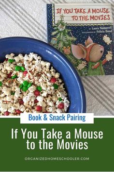 a bowl of popcorn and a book with the title if you take a mouse to the movies