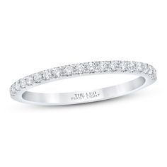 a white gold wedding band with rows of diamonds