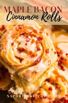 a close up of a cinnamon roll on a plate with the words maple bacon cinnamon rolls