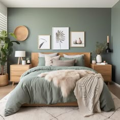 a bedroom with green walls and white rugs on the floor, two pictures above the bed