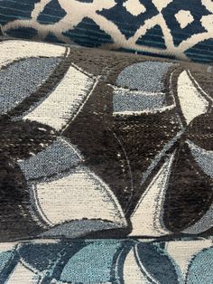 closeup of blue and white rugs with an intricate design on the top one