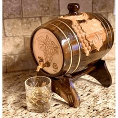 Beech wood wine barrel. Handmade with golden colored hoops.Hand-carved rustic design features great details and textures. Beautifully hand-craftedgrapedesignon both sides. Laser engraving on the front. High quality natural beech wood barrel is acraft masterpiece that gives an authentic look for wine organizers and bar counters. Leak-proof with easy to wash protective glass container inside the barrel. Fill with your favorite wine, whiskey, rum or any other beverage and enjoy. Details of the desi Nightstand Carafe, Hunting Cabin Decor, Wine Organization, Bar Counters, Crafting Room, Dad Crafts, Wood Barrel, Beer Making, Hunting Cabin