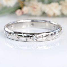 This unusual solid 950 platinum Celestial ring features hand engraved stars, moons, planets and a diamond sun, stars and planets - the heavens on your finger! Beautifully designed with a polished finish, the 3mm wide x 1.5mm deep comfort fit band is set with six 1.3mm fair trade Canadian diamonds. This ring would be an unusual wedding or eternity band, or a special gift for a birthday or anniversary. Handmade to order in any ring size, including half sizes and plus sizes. Please allow up to 10 w Celestial Wedding Band, Celestial Wedding Ring, Wedding Rings Platinum, 3mm Wedding Band, Star Wedding Band, High Jewelry Ring, Wide Wedding Rings, Platinum Rings, How To Wear Rings