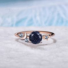 I LOVE YOU TO THE MOON BACK RING 1ct Round Cut Galaxy Starry Night Blue Goldstone Ring Cluster Alexandrite Wedding Ring Moon Star Design Unique Promise Ring Birthday Gifts Accept engrave the words inside the ring service: https://www.etsy.com/listing/1103764936/engrave-service HEALING RING : Blue Sandstone (also known as Blue Goldstone) symbolizes enterprise, success, victory, and glory, which enhance one's leadership and entrepreneurial skills. It is an excellent stone to meditate with before giving a speech or starting a new project. It is also very good at calming the senses and cleansing the chakras on all levels. Blue Sandstone bridges the gap between the earthly and spirit realms, so it is a great stone to use for contacting spirit guides or performing holistic healing. Blue Sandston Blue And Black Ring, Moon And Stars Wedding Ring, Night Sky Jewelry, Moon Promise Ring, Space Themed Engagement Ring, Starry Engagement Ring, Moon Ring Design, Galaxy Ring Engagement, Starry Night Ring