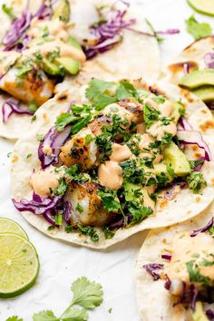 fish tacos with cabbage, avocado and cilantro