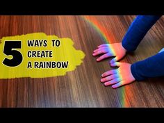 a child's hands on top of a wooden floor with the words 5 ways to create a rainbow