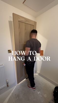 a man standing in front of a door with the words how to hang a door