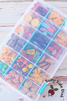 a plastic container filled with lots of different types of donuts