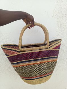 * The U-shopping Bolga basket is handwoven in Ghana by local artisans for market shopping, keeping groceries, decorating your living space, as gifts and storage of kids toys indoors and outdoors. Our  artisans supplement their seasonal farming occupation with earnings from weaving these baskets. * Materials used are natural and eco-friendly and have no effect to the user. * We deal in both Retail and wholesale. Contact us for make enquires on bulk orders, and answers to all of your questions. Care - To reduce shipping costs and other conditions beyond our control during shipping, baskets may be received pressed inward. - To regain the perfect basket stature, sprinkle water on the entire basket(Ensure the Leather doesn't get wet to avoid odor). - Straighten it with your hands to get the ori Beach Basket, Bolga Basket, Market Basket, Market Baskets, Market Shopping, Shopping Basket, Local Artisans, Storage Basket, Ghana