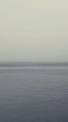 a boat floating on top of a large body of water