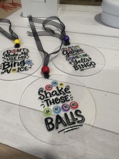 three glass plates with different sayings on them sitting on top of a white table