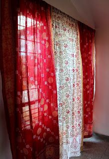 the curtains are red and white in color