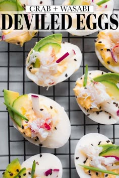 deviled eggs topped with crab, avocado and black pepper on a cooling rack