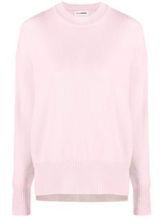 a pink sweater with long sleeves