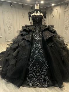 Gothic-Inspired Design: Combines elegance with a dramatic flair, perfect for making a bold statement at formal events. Off-Shoulder Neckline: Adds a touch of romance while elegantly showcasing the shoulders. Intricate Beaded Embellishments: Adorned with sparkling beads that enhance the luxurious appeal of the gown. Ruffled Layers: Dramatic layers of tulle create volume and movement, ensuring you capture attention. Elegant Cape Detail: Provides an exquisite addition that enhances the sophisticati Elegant Cape, True Bride, Pretty Quinceanera Dresses, Detachable Train, Fantasy Gowns