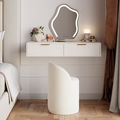 a bedroom with white furniture and a large mirror on the wall