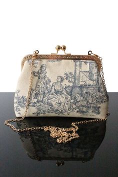 "Ideal Toile de jouy bag for Wedding day or Evening bag, in addition to be elegant, original and comfortable, this bag makes you unique. Indeed every bags in our collection are unique, everyone can have a high know how and original design bag. We always exploring new designs and details to offer the best quality as well as a large offer of bags in terms of your wishes (height, color, texture). These bags you will be essentials to put different objects and accessories. Our collection of Toile de Linen Handbags, Bag For Wedding, Spring Purses, Dream Bags, Design Bag, Women Purse, Wedding Clutch, Elegant Bags, Navy Blue Wedding