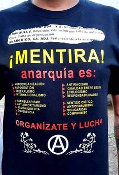 a man wearing a t - shirt that says mentira anarquia ess organize y lucia