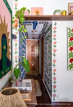 the hallway is decorated with art and plants