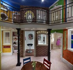 the inside of a dollhouse with furniture and accessories on display at the top floor