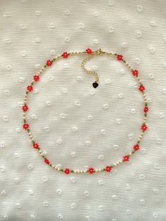 "This necklace features red poinsettias and holiday colors: cream, red, greens, and 24k gold plated seed beads. Length: 16\" inches Seed Bead Size: 11/0, 6/0 Adjustable: Each necklace has a 2.5\" gold filled lobster clasp extender Strung on: Non-Stretchy Beading Thread" Red Seed Bead Jewelry, Beaded Necklace Seed Beads, Strawberry Seed Bead Necklace, Beaded Christmas Necklace, Seed Beads Crafts, Beaded Bracelets Seed Beads, Seed Bead Flower Pattern, Seed Bead Jewelry Necklaces, Red Seed Bead Necklace