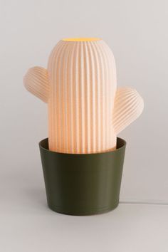 a cactus shaped light sitting in a pot