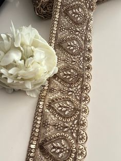 Introducing you to the fabulous Hand Embroidered Gold Mirror Work Border. It's a real gem! Picture this: intricate mirror-work delicately embroidered by hand. A border that exudes style and elegance. Get ready to dazzle and make a statement with this beautiful creation. Trust me, you'll be turning heads and receiving compliments left and right! So go ahead, and let your creativity shine with this amazing gold mirror-work border. We are constantly adding new items, and you'll find our complete in Sari Lehenga, Saree Border, Mirror Work, Indian Attire, Paisley Design, Festival Wear, Bridal Wear, Antique Gold, Lace Trim