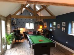 a pool table in the middle of a living room