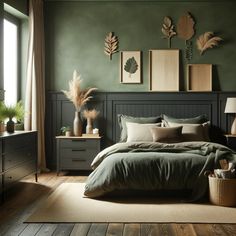 a bedroom with green walls and wooden flooring is pictured in this image, there are plants on the wall above the bed