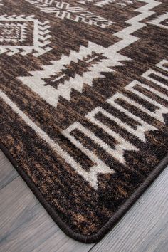 a brown and white rug on the floor