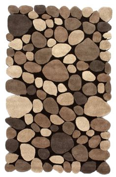 a brown and white rug with rocks on it