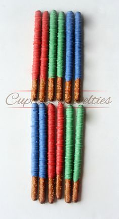 six different colored cookies are arranged in a row