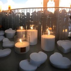 several candles are lit in front of some people