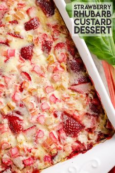 strawberry rhubarb custard dessert in a white casserole dish