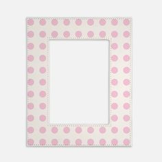 a pink and white photo frame with polka dot pattern on it, in the shape of a square