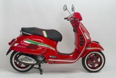 a red scooter with green and white stripes