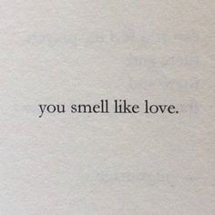 the words you smell like love are written in black ink