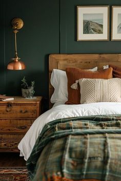 a bedroom with green walls and plaid bedding