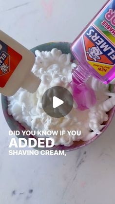 a bowl filled with whipped cream next to a bottle of deodorant