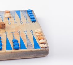 an old board game with blue and white pieces