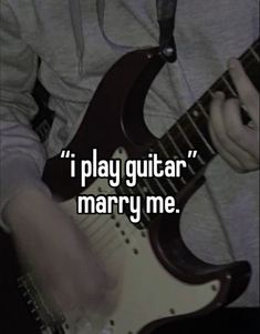 someone is playing guitar with the caption i play guitar marry me on their chest