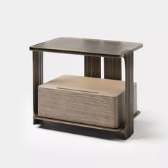 an end table with a wooden box on top and a metal frame around the edge