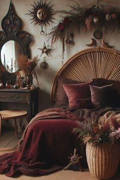 a wicker bed with pillows and blankets on it in a room filled with decorations