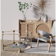 a living room scene with focus on the chair and sideboard that has been made out of wood