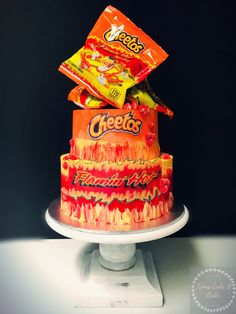 a multi layer cake with candy on top