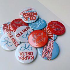 a pile of buttons that say happy lady and have been made to match each other