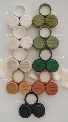 several different types of buttons and lids on a white surface