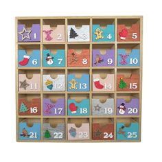 a wooden calendar with twelve different numbers and christmas decorations on the front, including santa's stocking