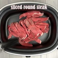 sliced beef in an iron skillet with the words sliced round steak